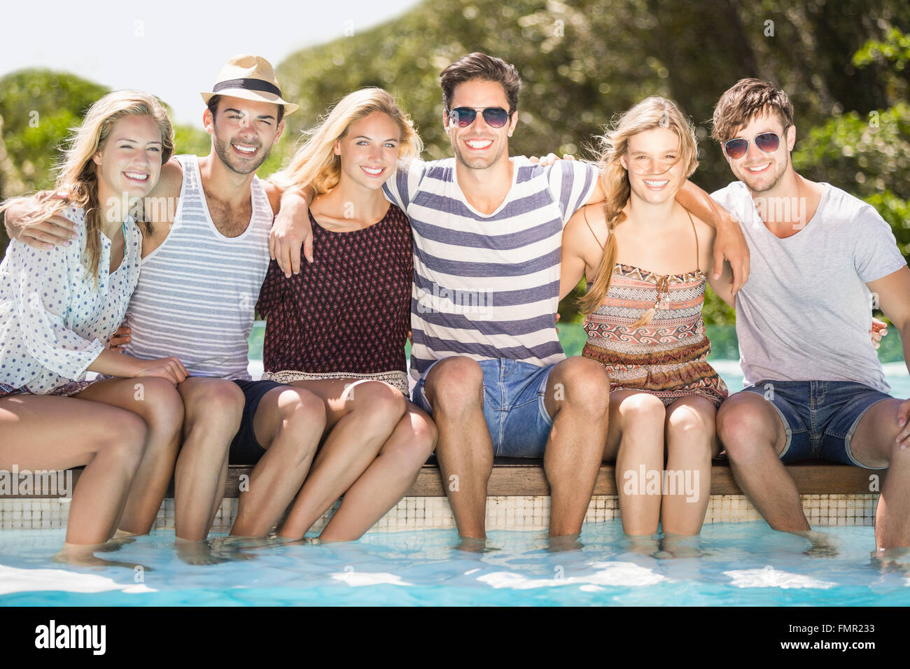 Group male female friends sitting hi-res stock photography and images ...