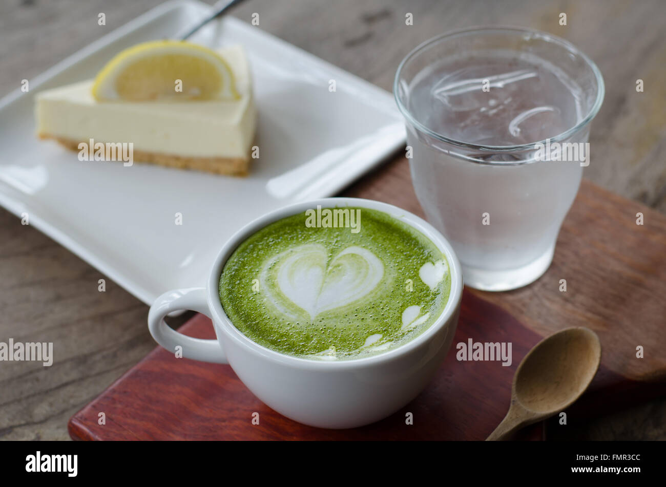 Green tea Latte/Matcha tea art and lemon cake Stock Photo