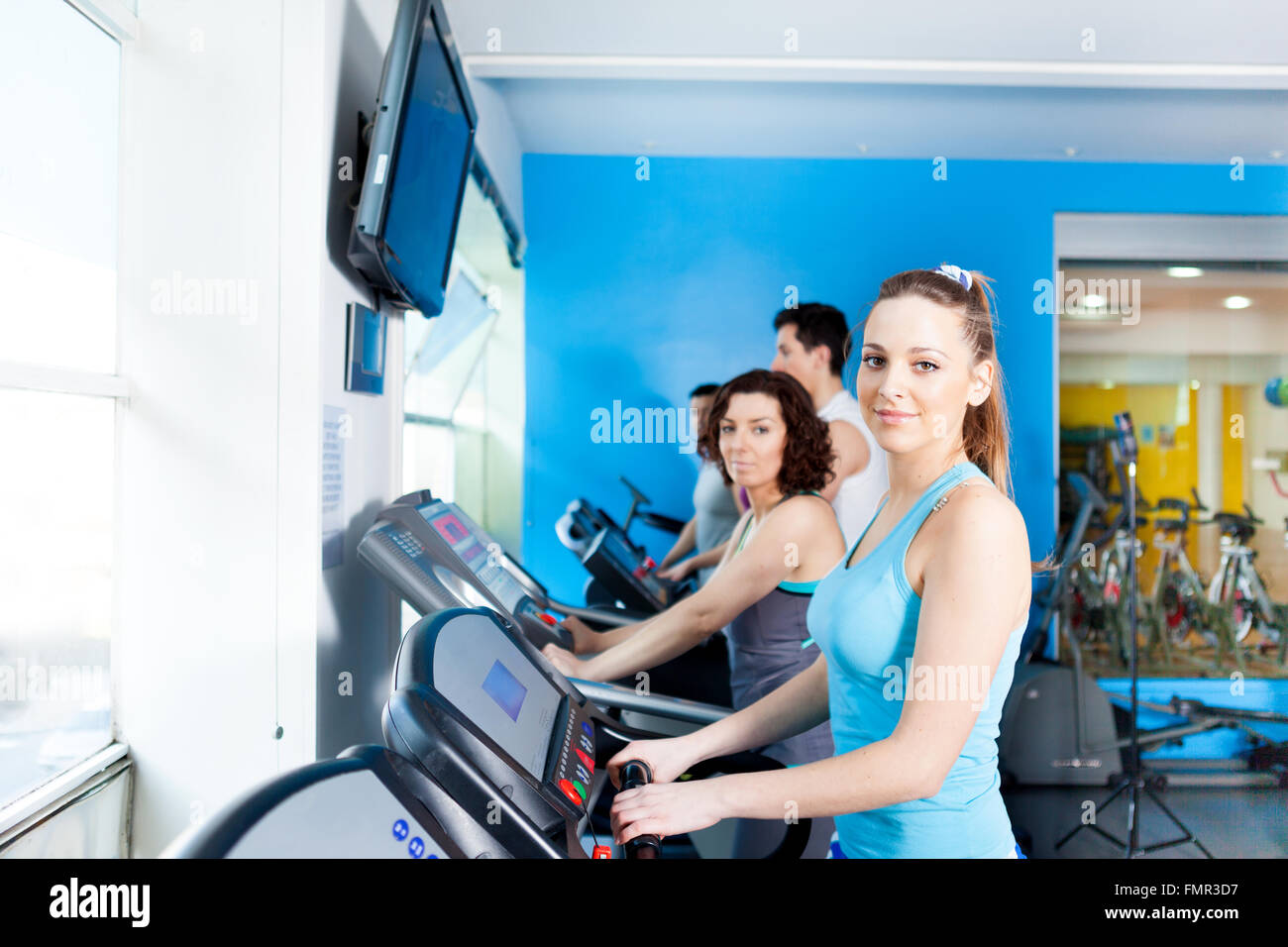 Group of people in the gym doing cardio training Stock Photo