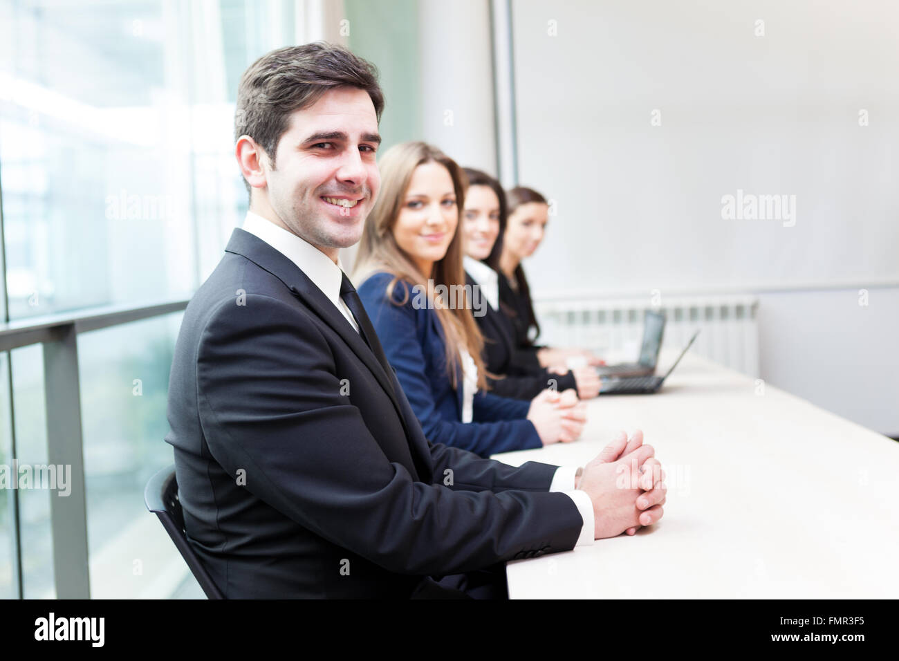 Group of business people smiling at the office lined up Stock Photo - Alamy