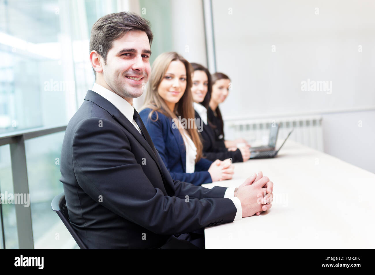 Group of business people smiling at the office lined up Stock Photo - Alamy