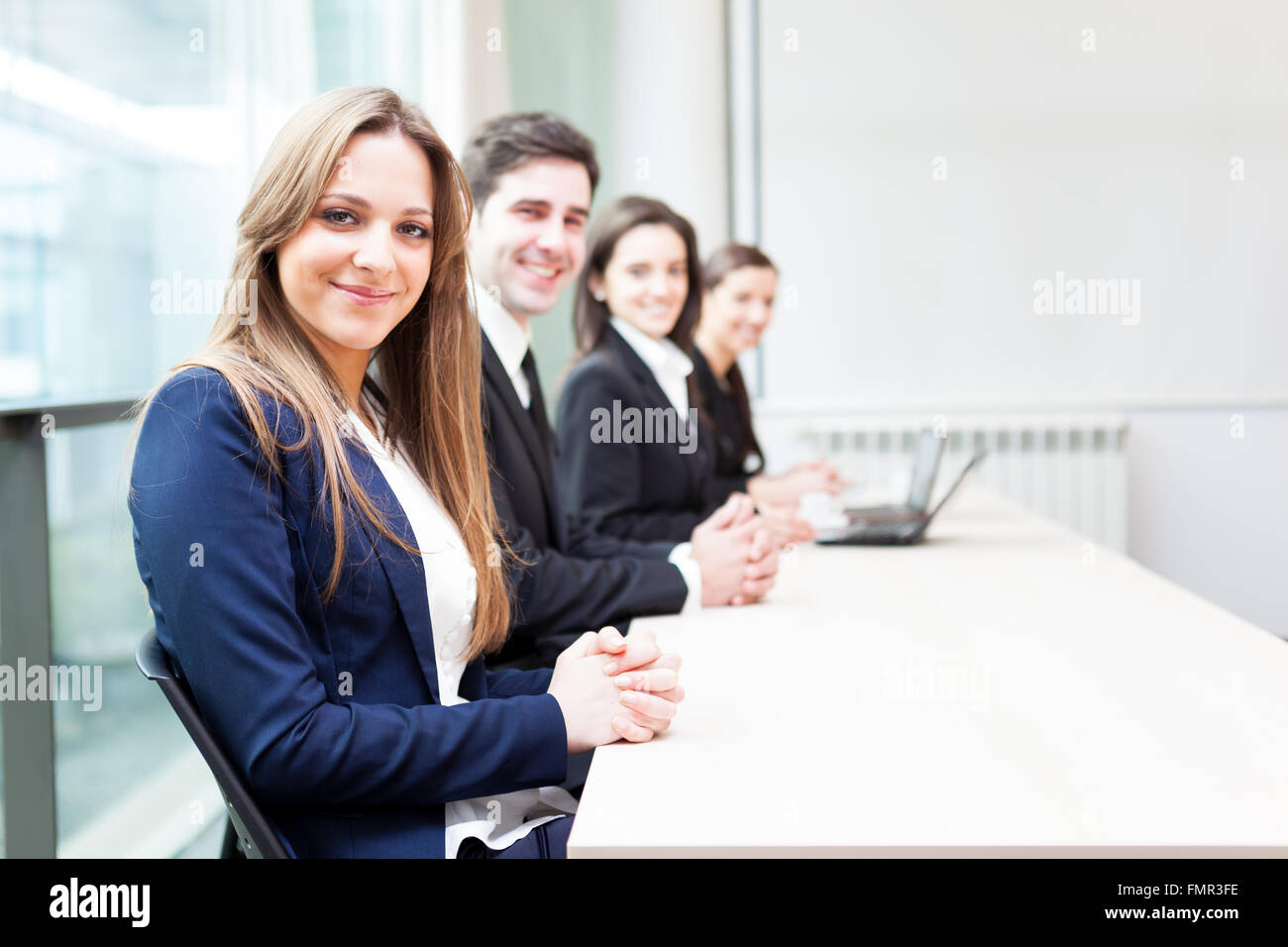 Group of business people smiling at the office lined up Stock Photo - Alamy