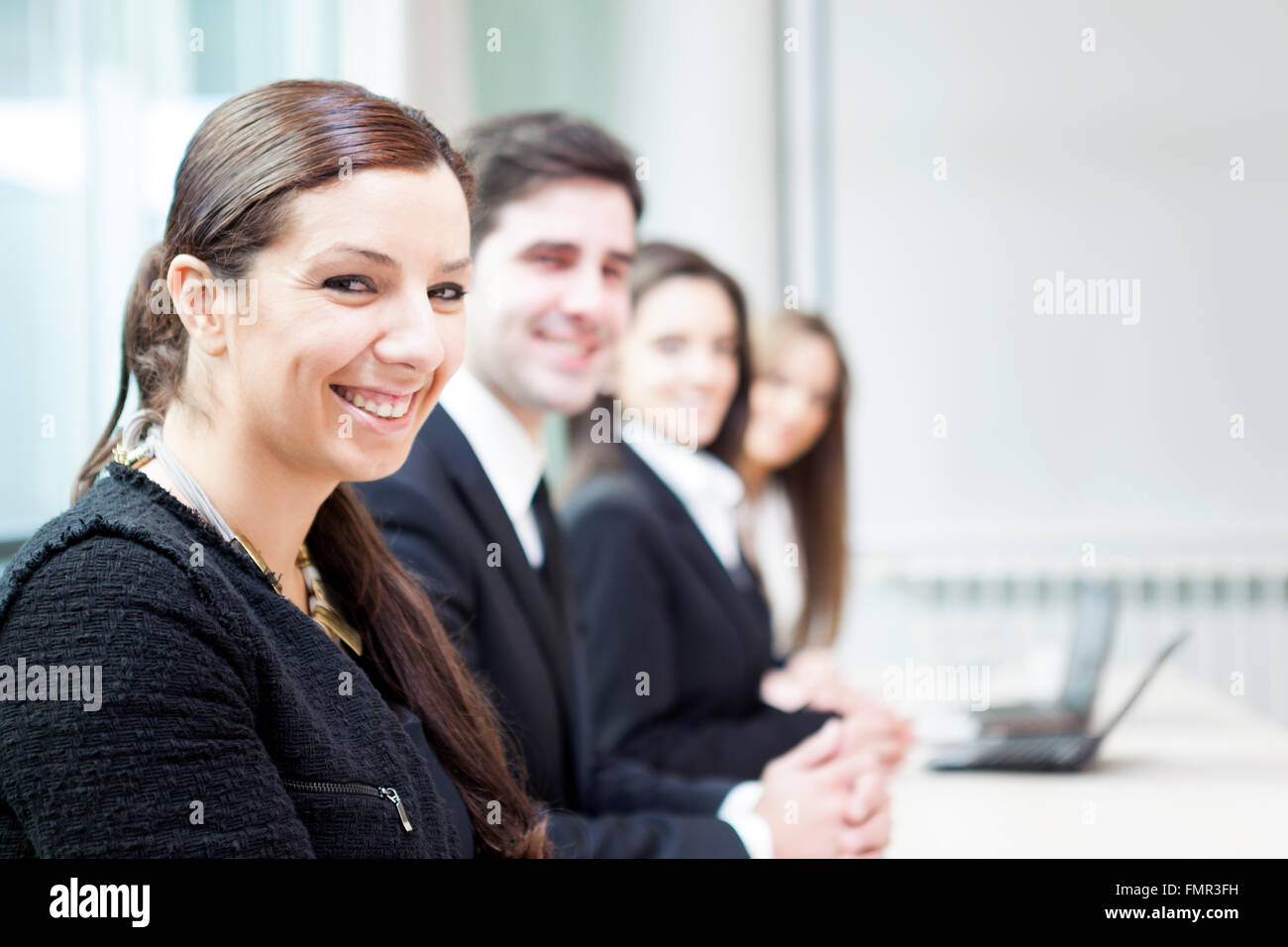 Group of business people smiling at the office lined up Stock Photo - Alamy
