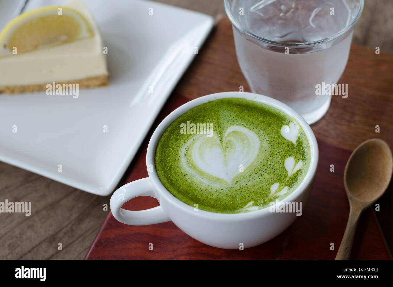 Green tea Latte/Matcha tea art and lemon cake Stock Photo