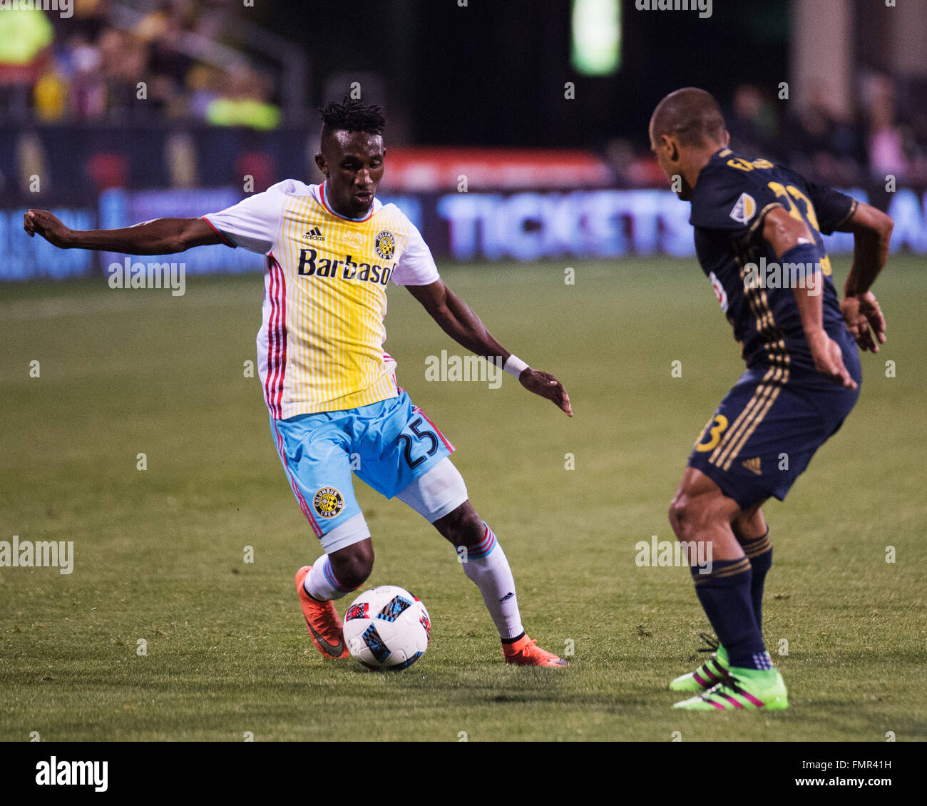 Columbus, Ohio, USA. 12th March, 2016. Columbus Crew defender Harrison Afful (25) goes one on one with Philadelphia Union defender Anderson Conceicao (23) in the second half. Columbus, Ohio, USA Credit:  Brent Clark/Alamy Live News Stock Photo