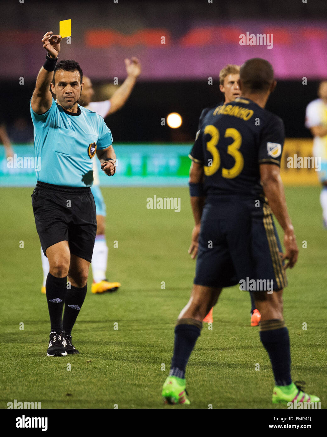 Columbus, Ohio, USA. 12th March, 2016. Referee Hilario Grajeda sows Philadelphia Union defender Fabinho (33) a yellow card in the second half in the match against Columbus. Columbus, Ohio, USA Credit:  Brent Clark/Alamy Live News Stock Photo