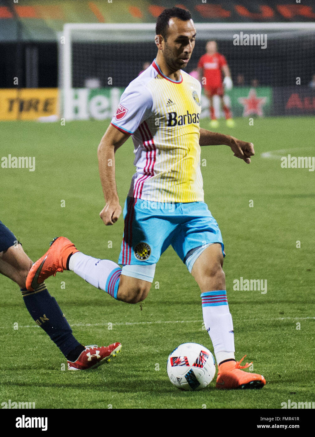 Columbus, Ohio, USA. 12th March, 2016. Columbus Crew forward Justin Meram (9) serves the ball into the middle in the nmatch against Philadelphia. Columbus, Ohio, USA Credit:  Brent Clark/Alamy Live News Stock Photo