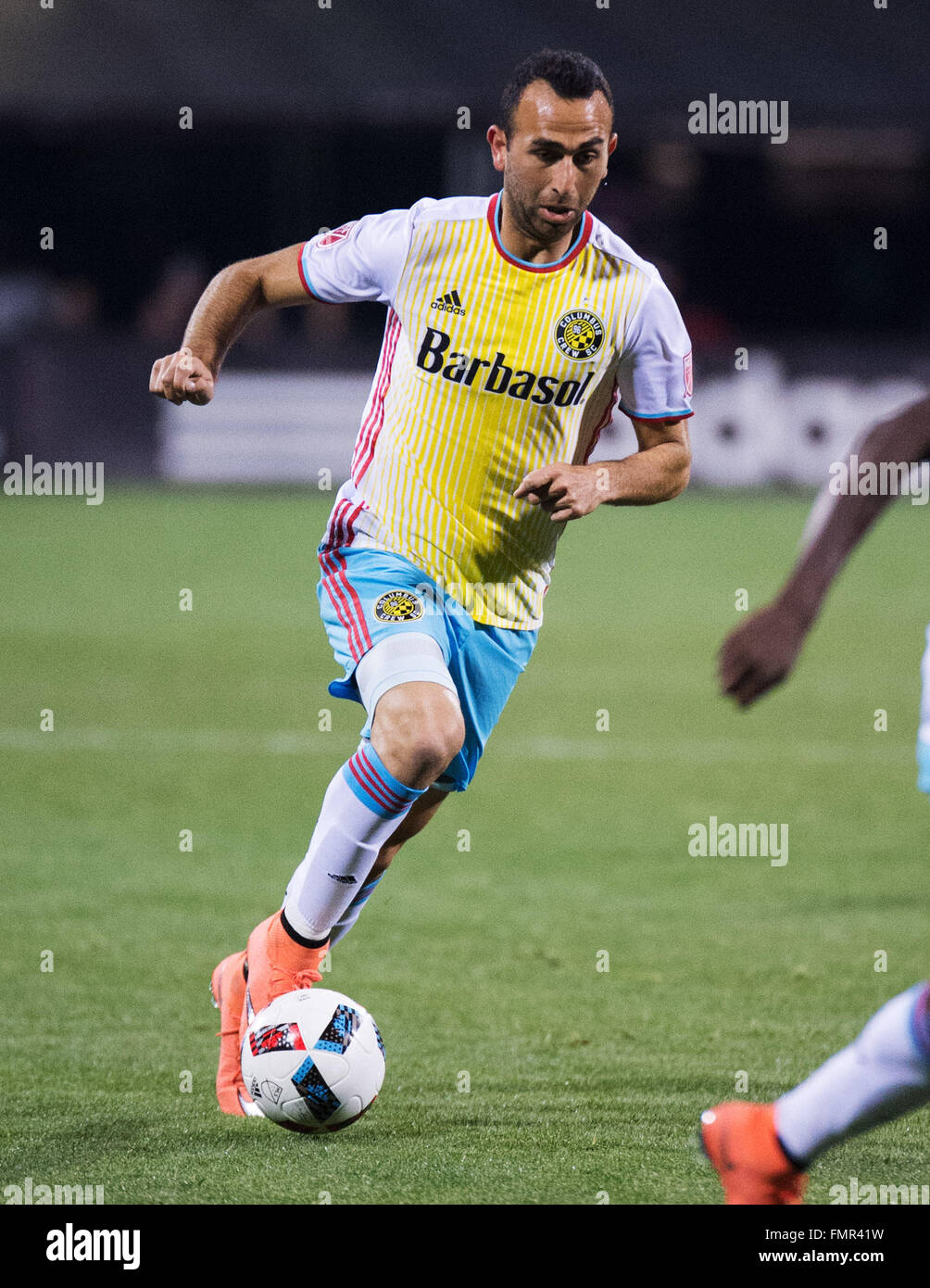 Columbus, Ohio, USA. 12th March, 2016. Columbus Crew forward Justin Meram (9) dribbles the ball down the pitch in the match against Philadelphia at Mapfre Stadium. Columbus, Ohio, USA Credit:  Brent Clark/Alamy Live News Stock Photo