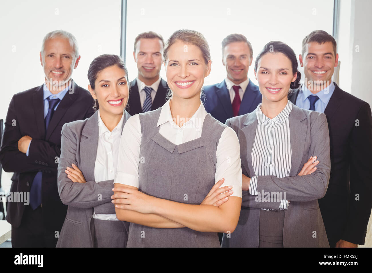 Team of businesspeople posing together Stock Photo - Alamy