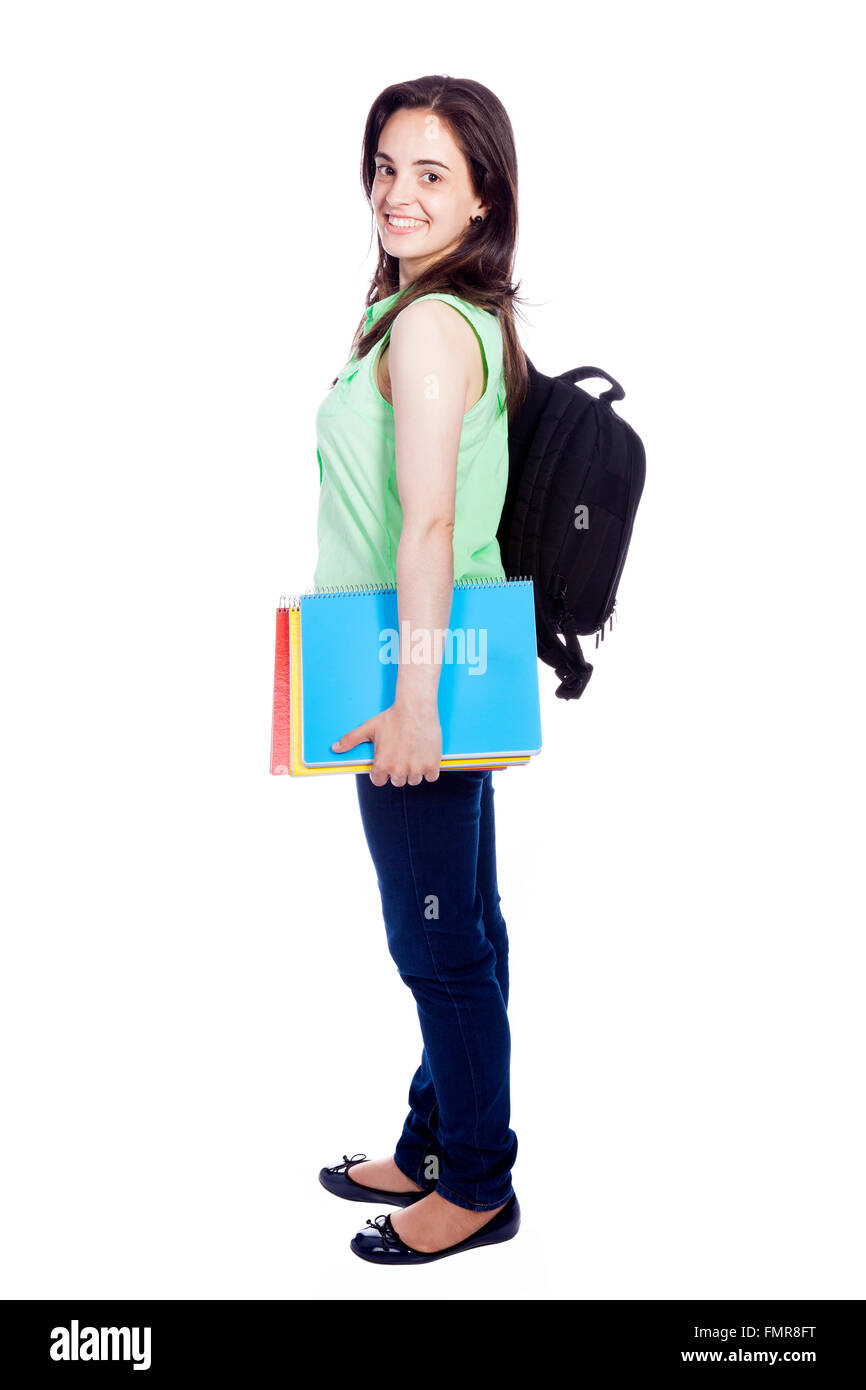 Side view of a female student carring notebooks and backpak, isolated on white Stock Photo