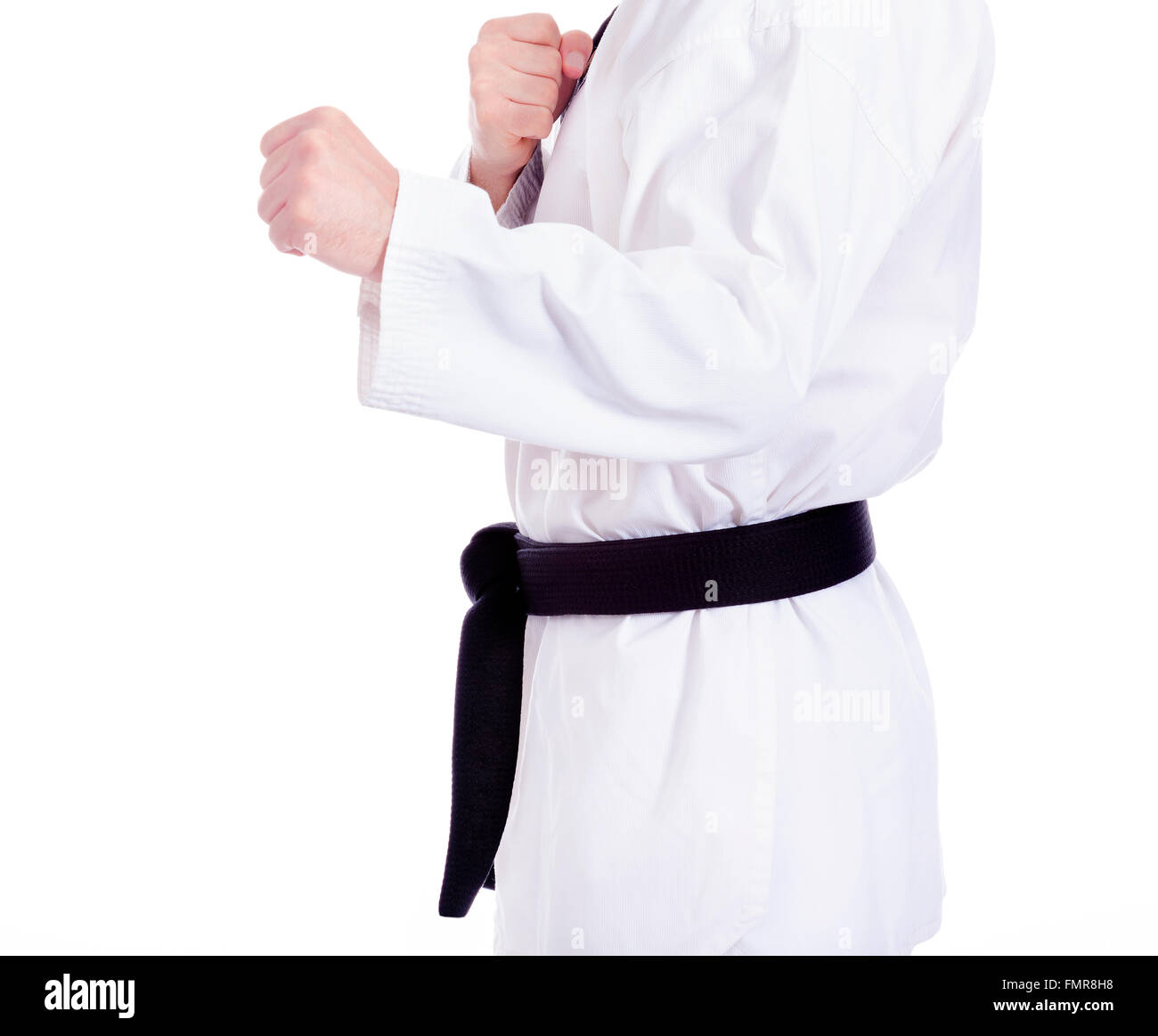 Black belt man practicing martial arts, isolated on white Stock Photo
