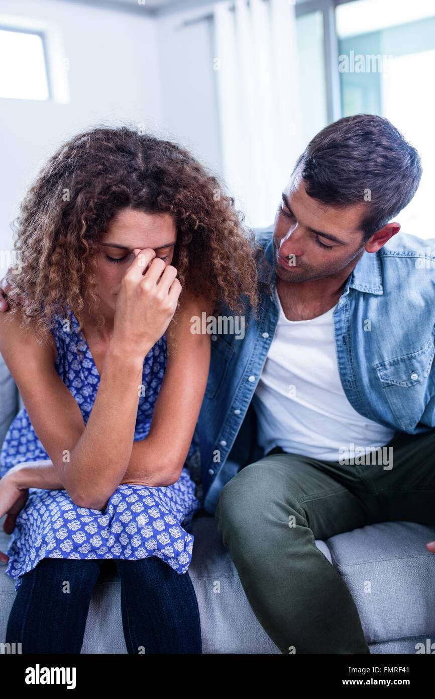 Young couple sitting together and discussing after a fight Stock Photo ...