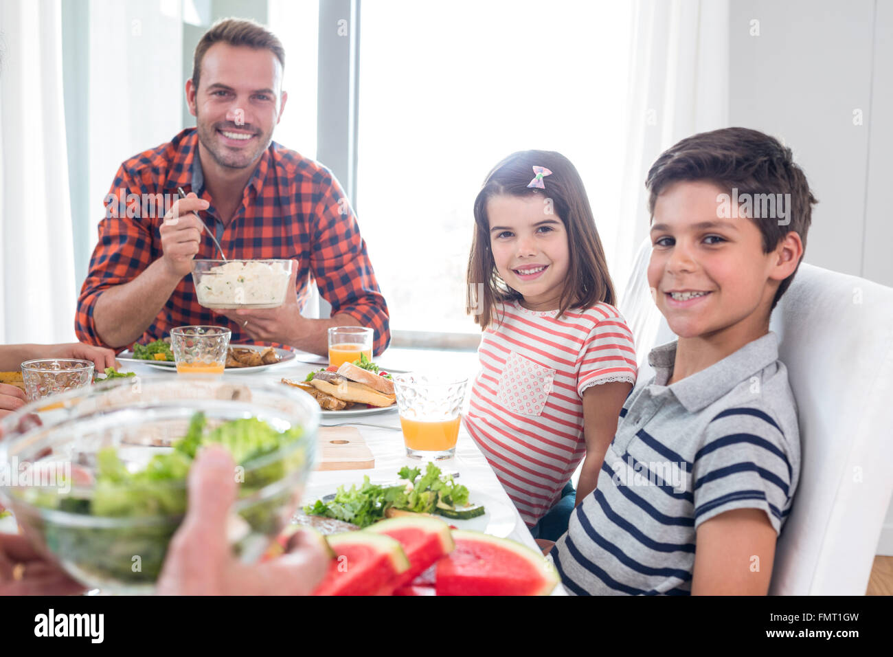 Happy family having breakfast Stock Photo - Alamy