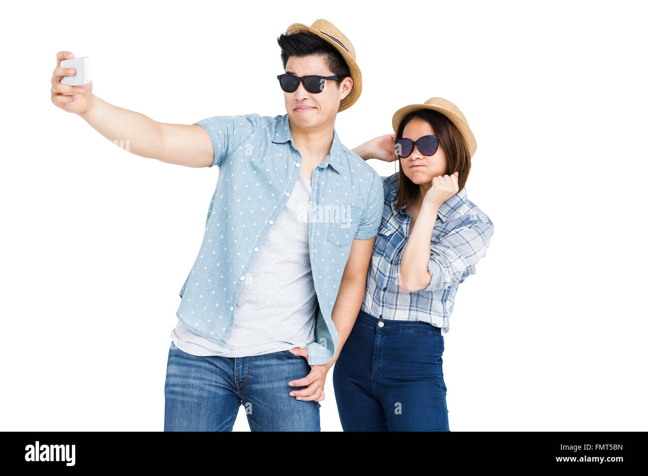 Happy young couple taking a selfie Stock Photo - Alamy