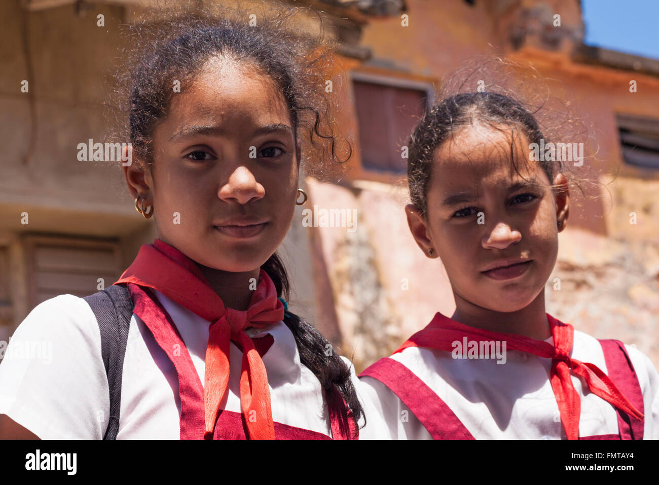Daily life in Cuba Two school girls looking at camera at Trinidad