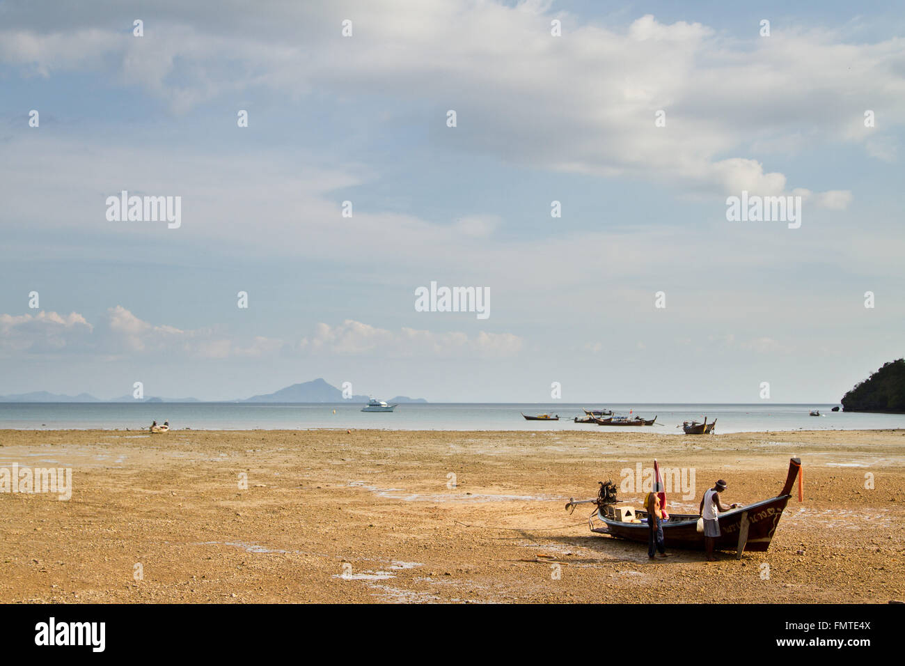 Painting a Long tail boat  in Railay Beach Thailand Stock Photo