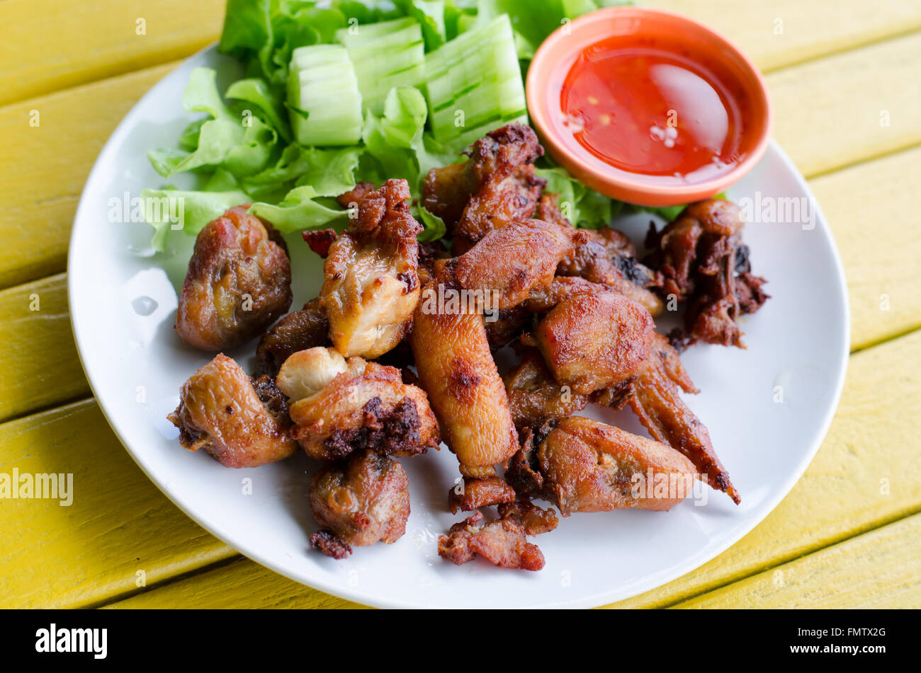 Fried chicken with spicy sauce Stock Photo