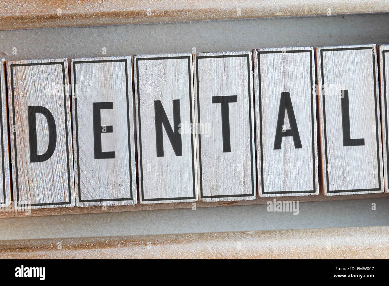 Dental word written on wood Stock Photo Alamy