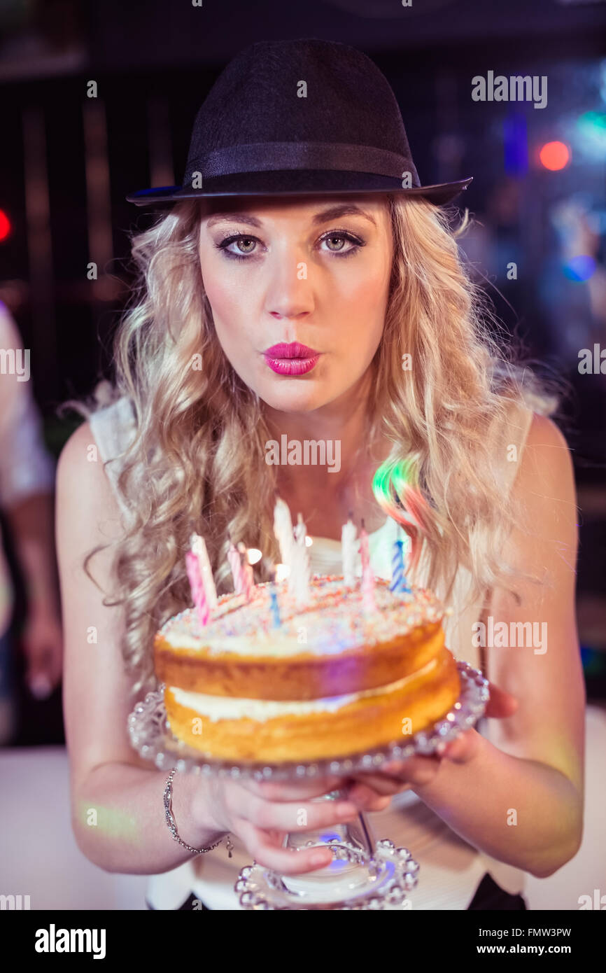 Woman blowing out candles Stock Photo Alamy