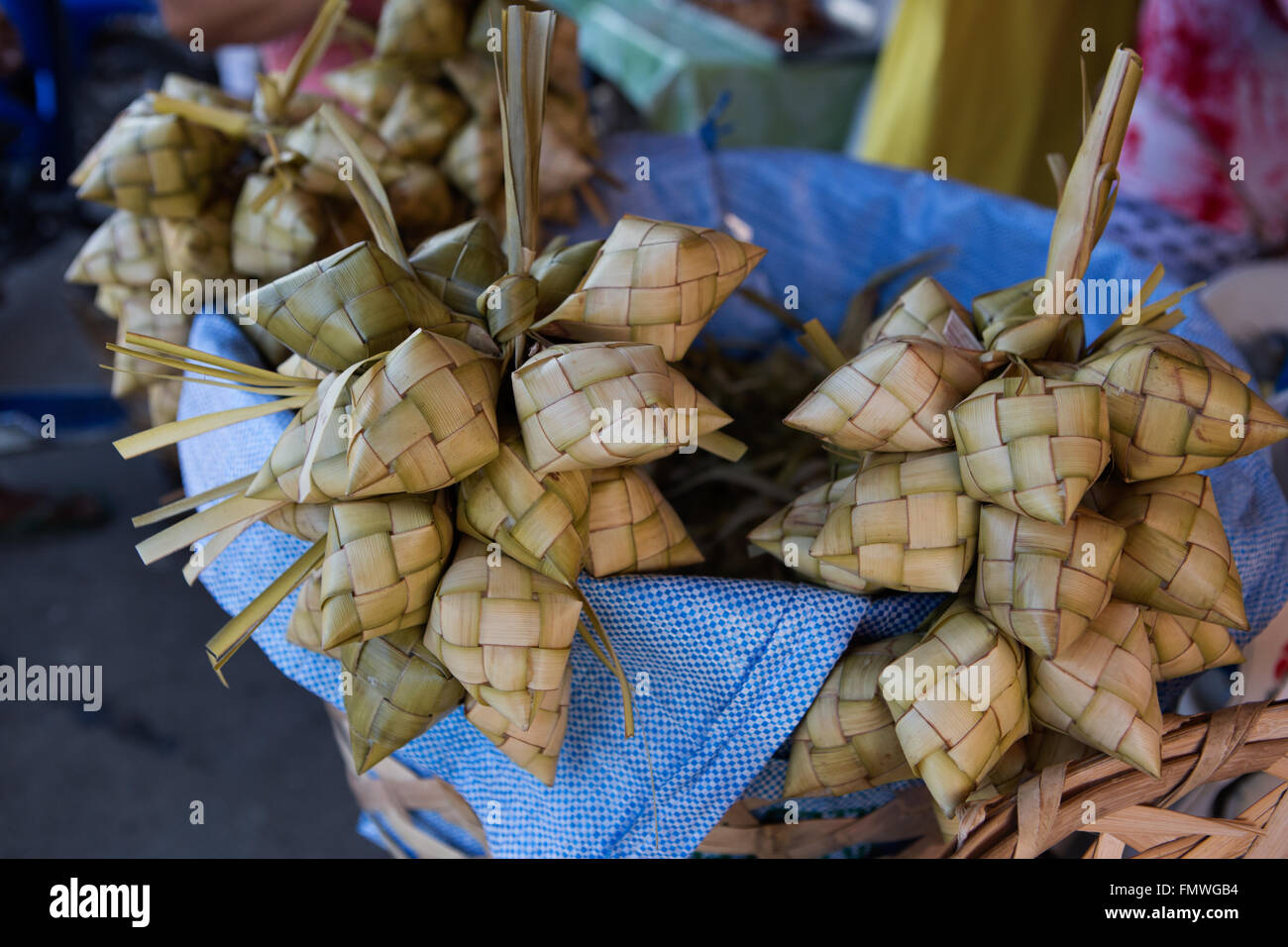 Rice steamed in young woven coconut leaves,known as Puso, a speciality of the Visayas area in the Philippines Stock Photo
