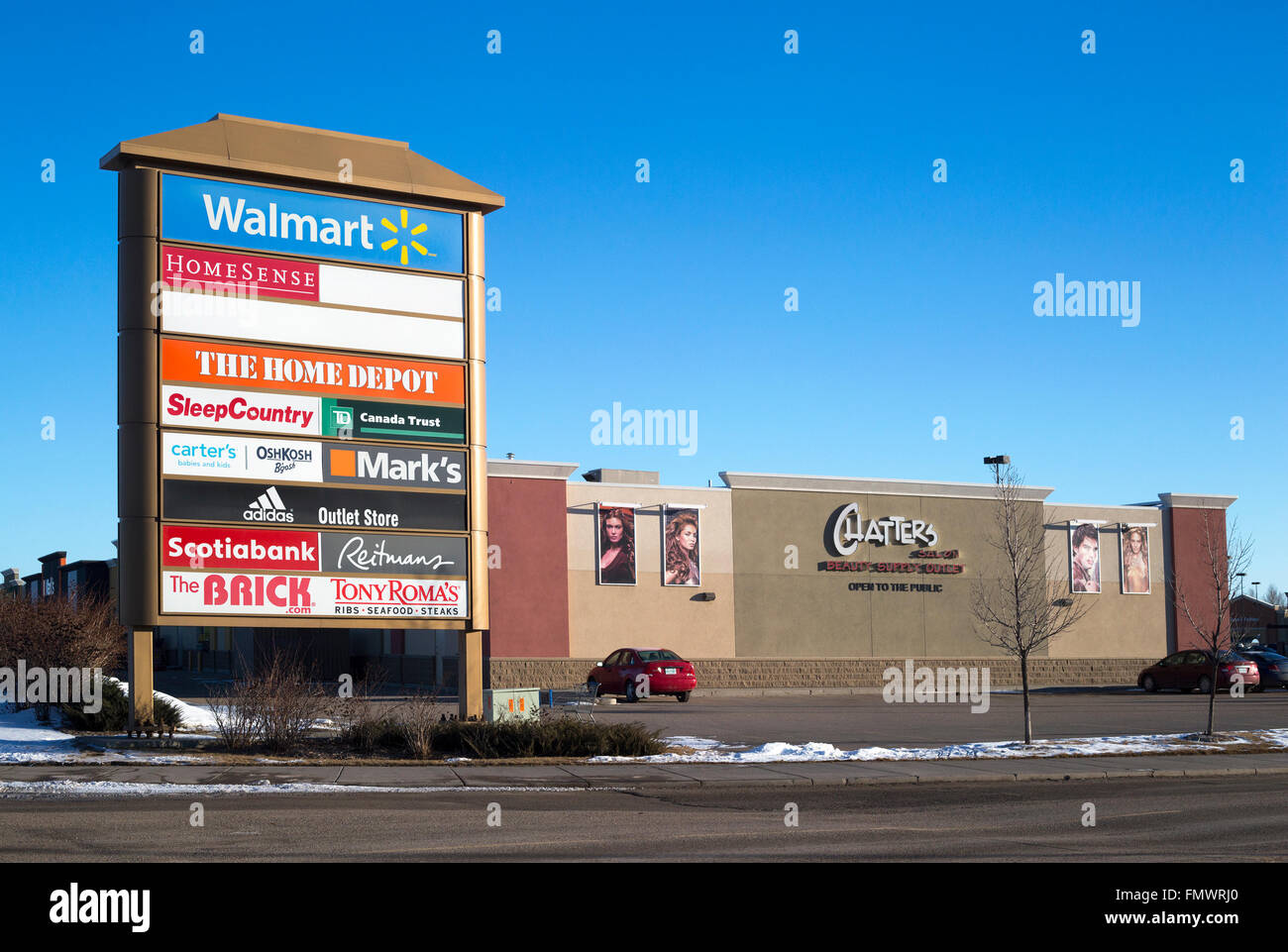 Entrance sign listing stores in suburban shopping Center Stock Photo