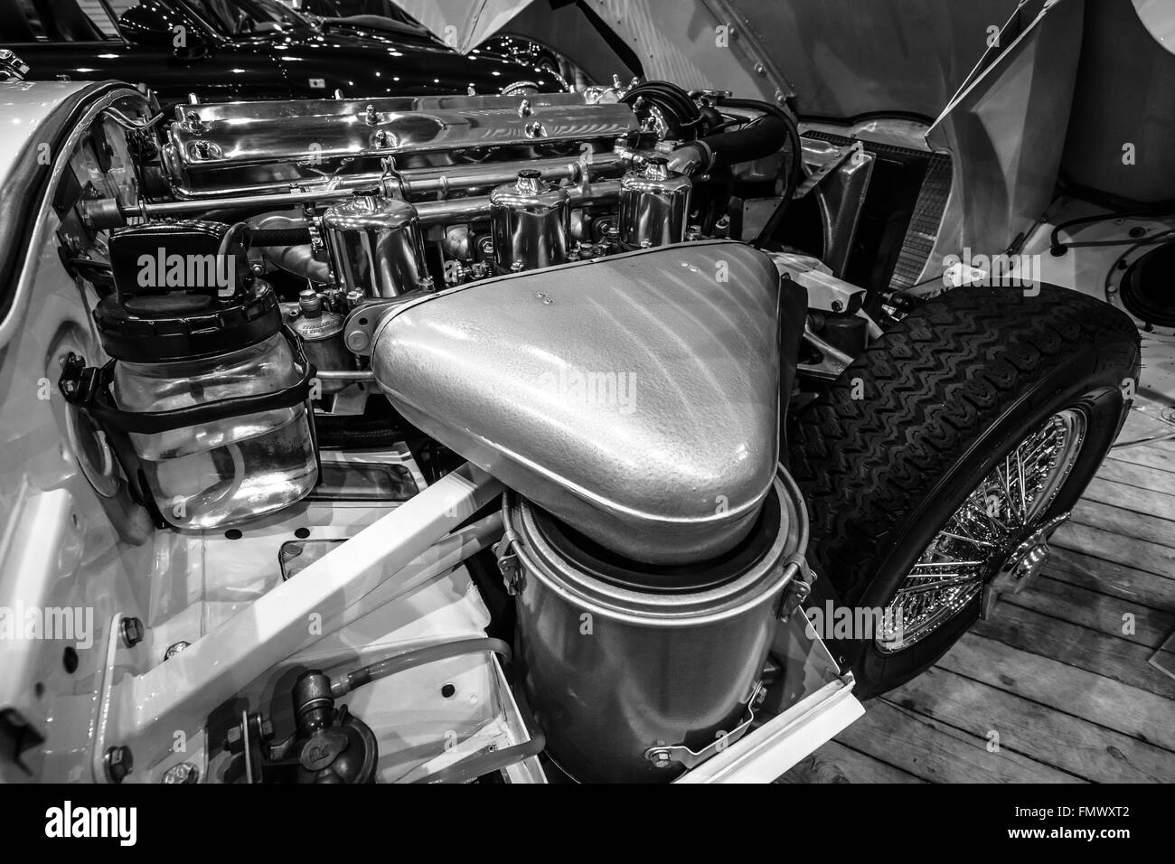 Engine compartment Jaguar E-Type Series 1 coupe, 1963. Black and white. Stock Photo