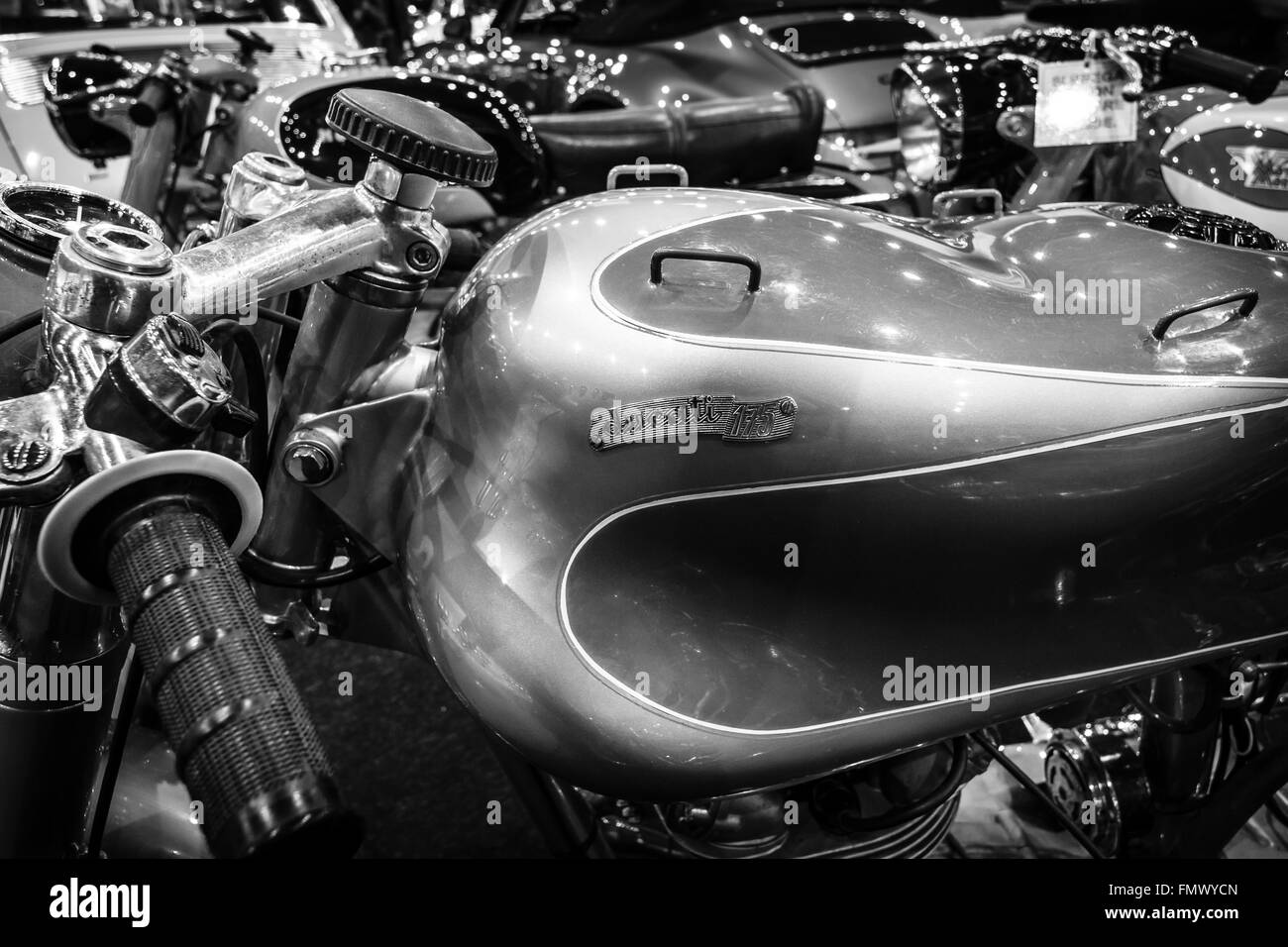 Fragment of retro motorcycle Ducati 175, close-up. Black and white. Stock Photo