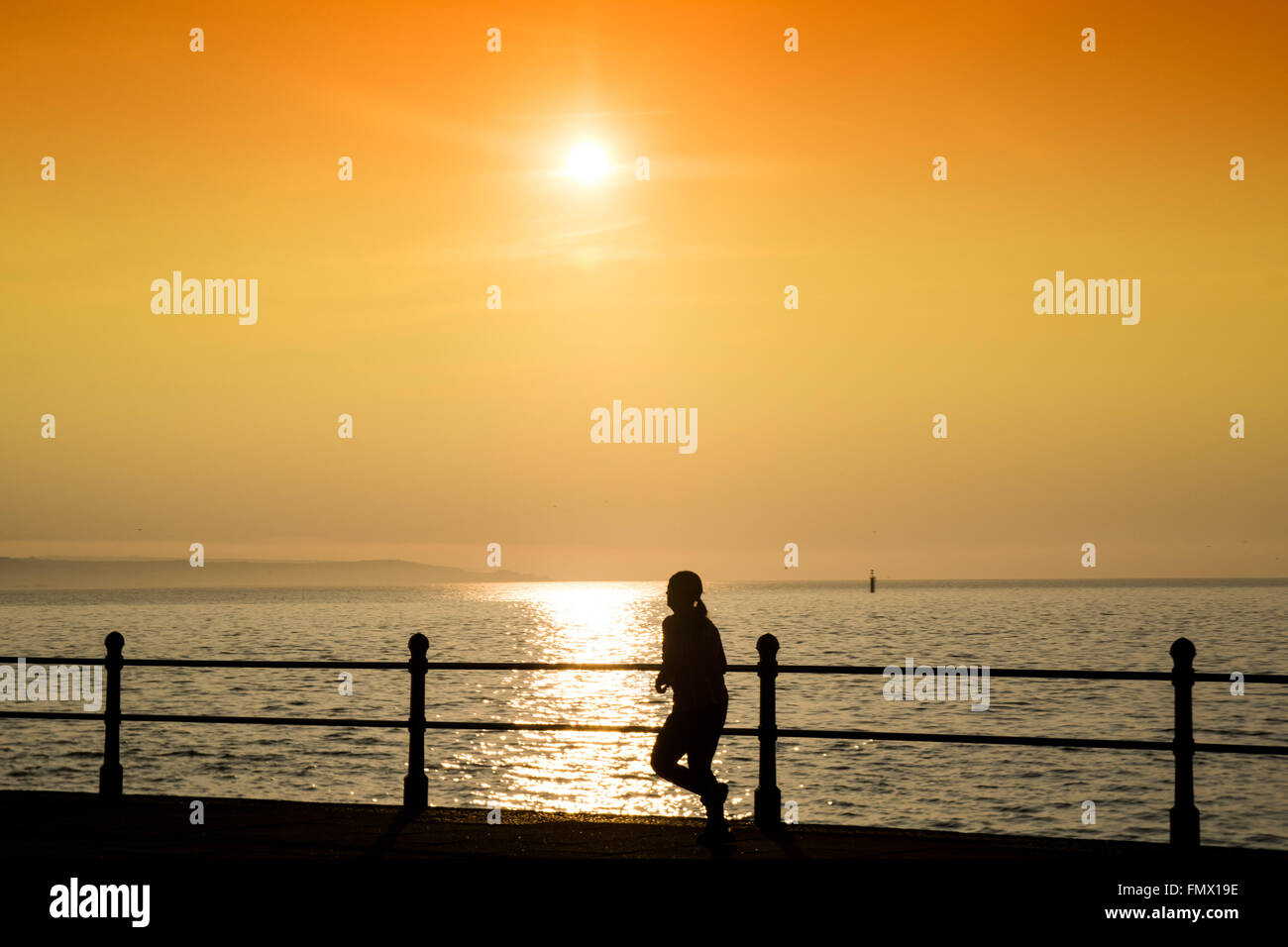 Penzance, Cornwall, UK. 13th March 2016. UK Weather. Another glorious start to the day in Cornwall with joggers and swimmers out in the early morning sun. Credit:  Simon Maycock/Alamy Live News Stock Photo