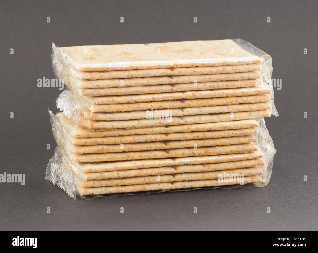 Crackers in plastic, isolated on a grey background Stock Photo - Alamy
