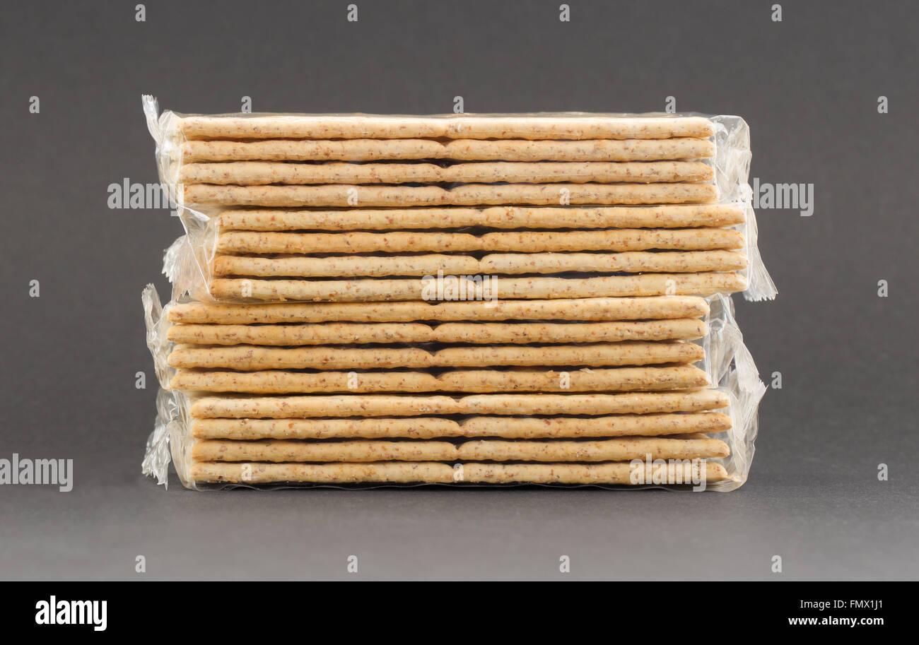 Crackers in plastic, isolated on a grey background Stock Photo - Alamy