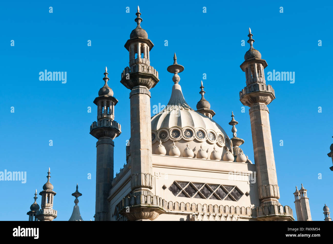 Detail of the columns, towers and domes of the Royal Pavilion in Brighton, East Sussex, England at sunset Stock Photo