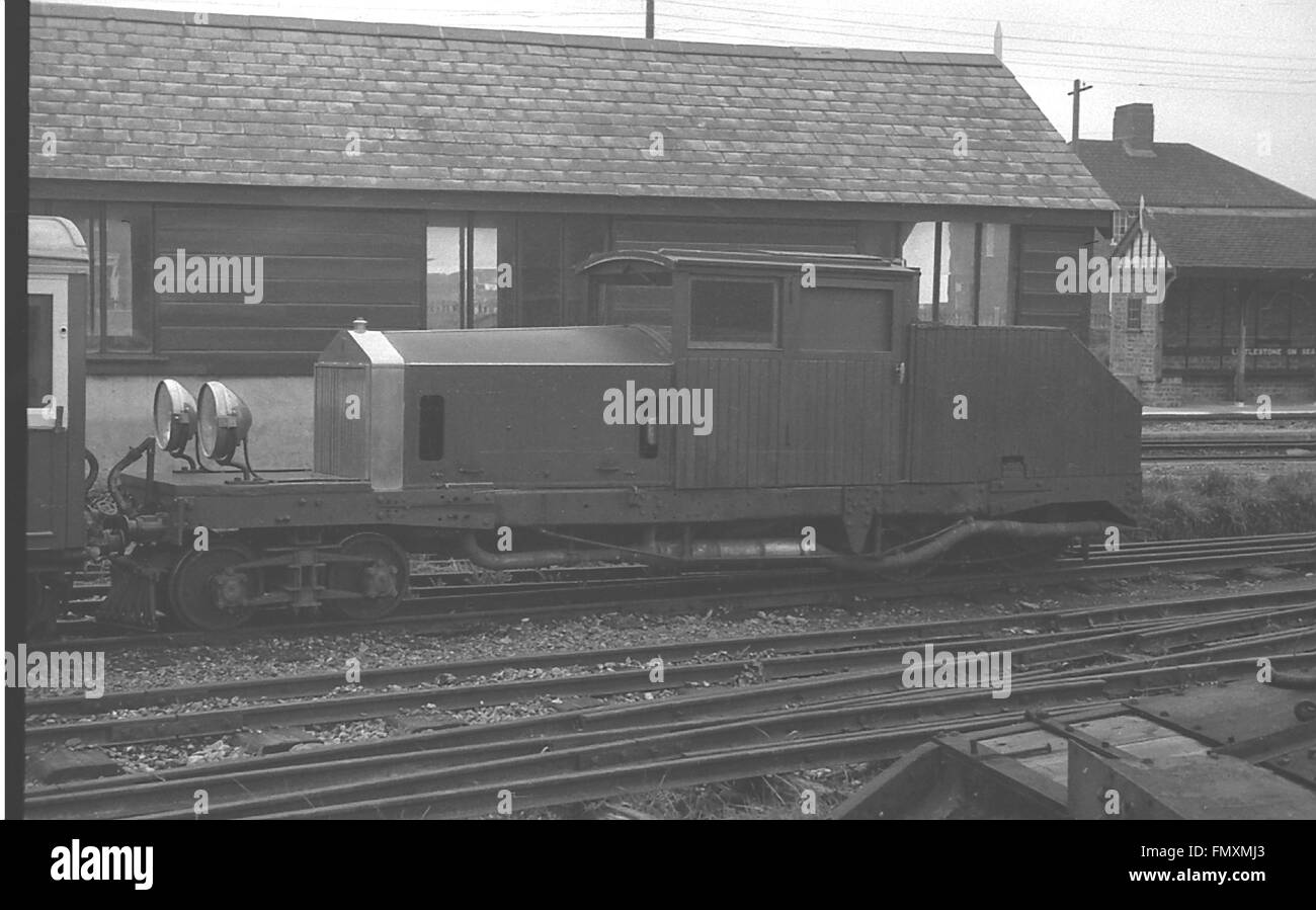 In 1931, Howey converted his 1914  Rolls-Royce Silver Ghost into a locomotive for the Romney Hythe & Dymchurch Railway  that survived until 1961.  It is seen here at Littlestone-on-Sea Station, before 1955 Stock Photo