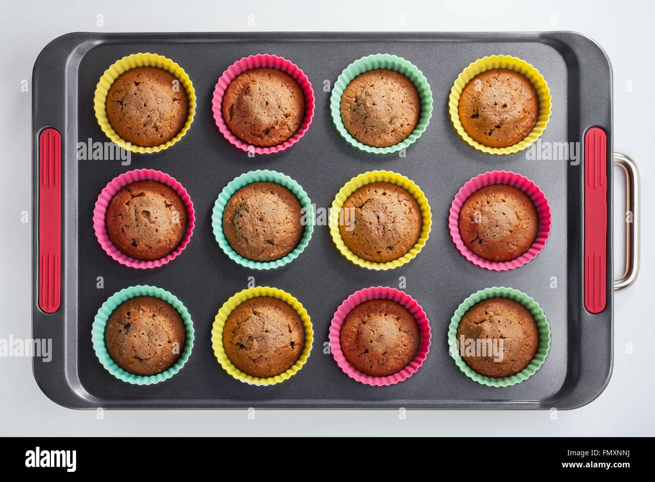 Cakes in molds on a tray after baking in the oven Stock Photo Alamy
