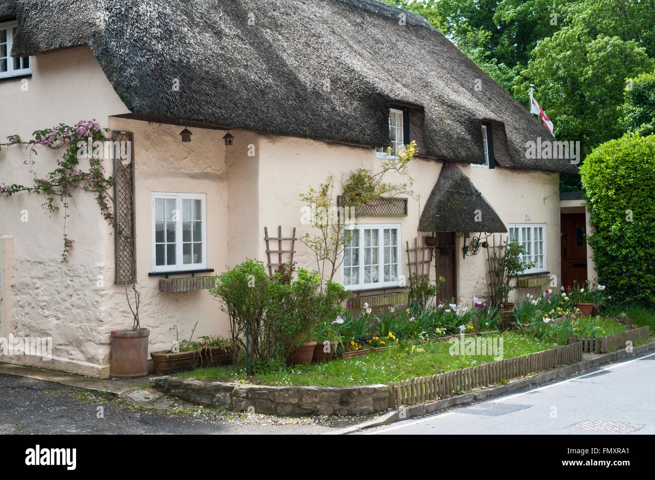 A traditional English thatched cottages in West Lulworth, Dorset, England Stock Photo