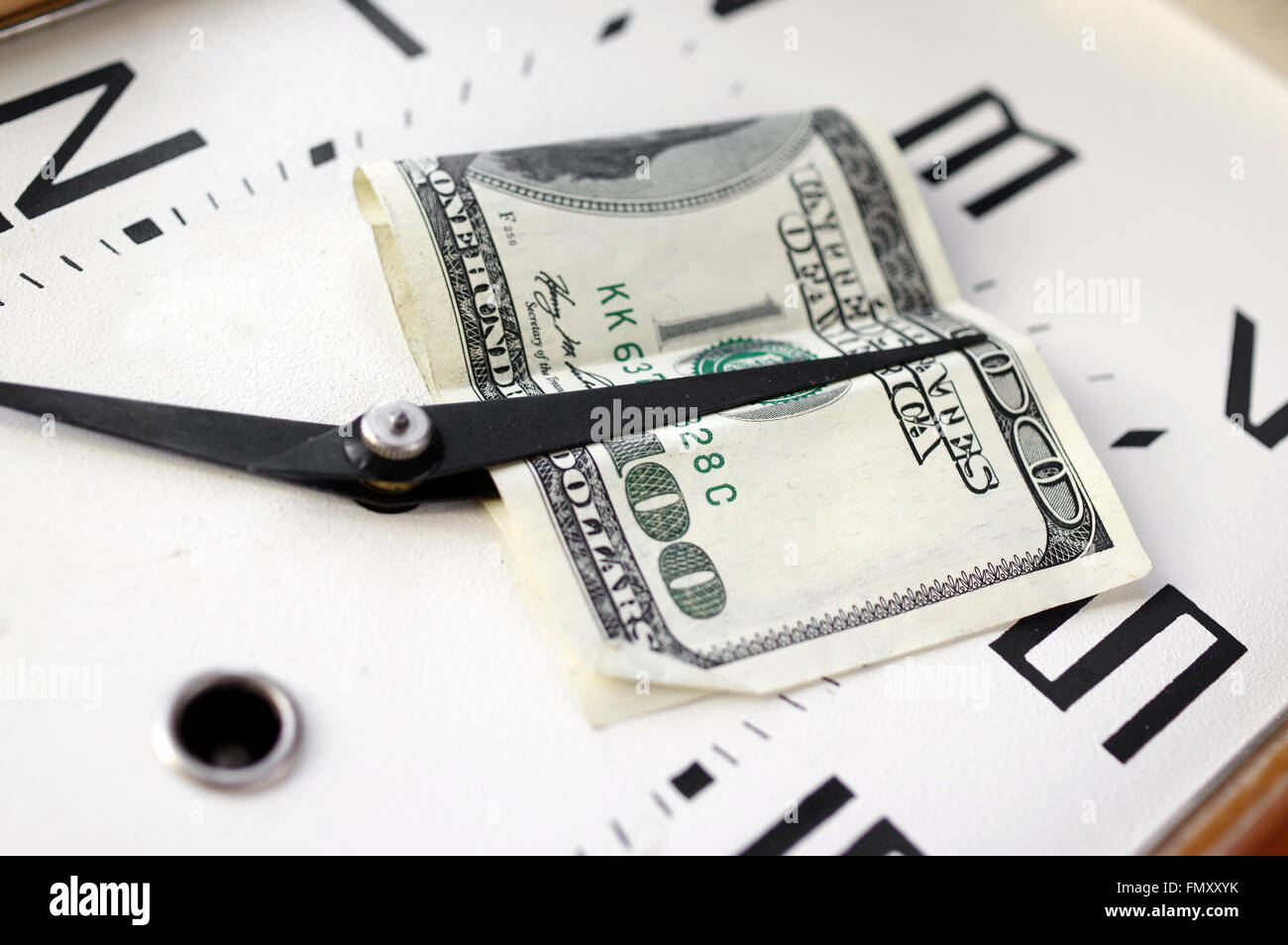Dollars On A Clock Stock Photo