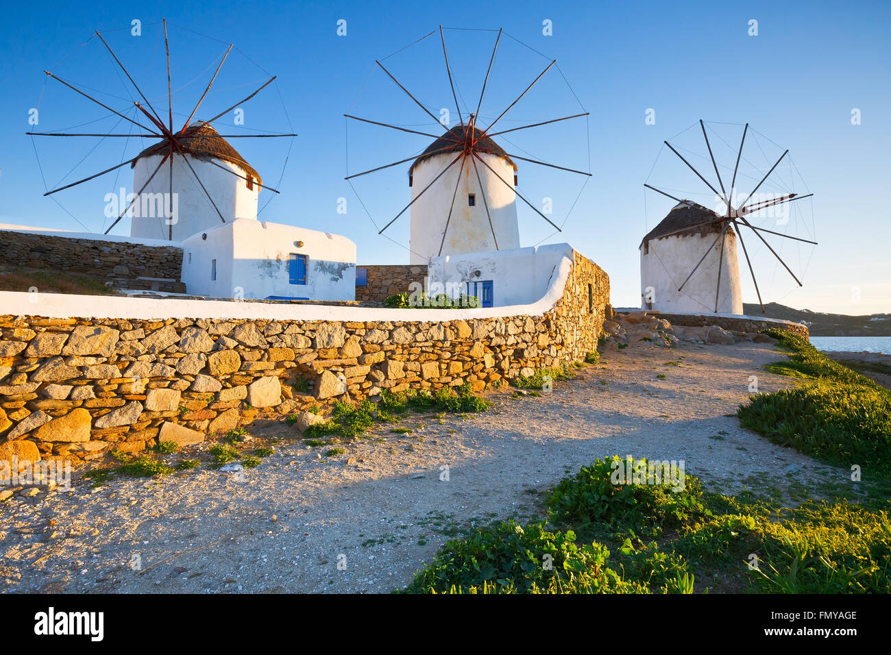Traditional windmills in the town of Mykonos, Greece. Stock Photo