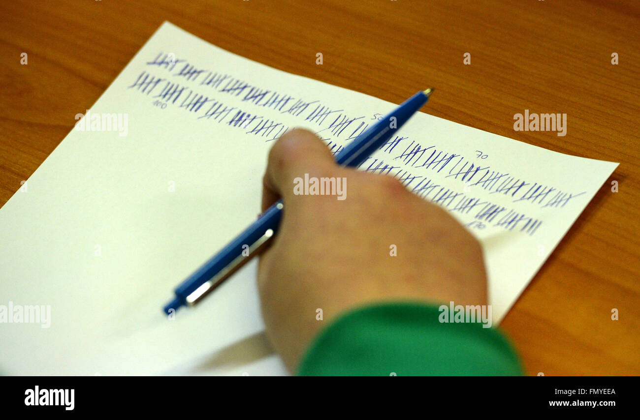 Wittenberg, Germany. 13th Mar, 2016. A poll worker counts the ballots for the state parliamentary elections in Wittenberg, Germany, 13 March 2016. Photo: RALF HIRSCHBERGER/dpa/Alamy Live News Stock Photo
