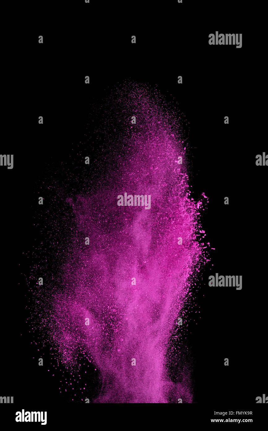 Launched colorful powder, isolated on white background Stock Photo - Alamy