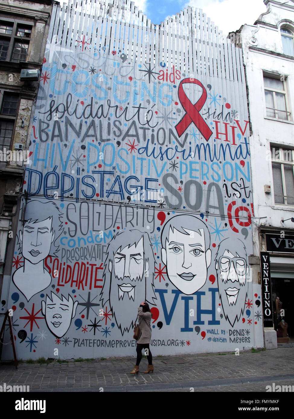 Murs Solidarite Sida by Denis Meyers,rue du marche aux Herbes,Brussels,Belgium Stock Photo