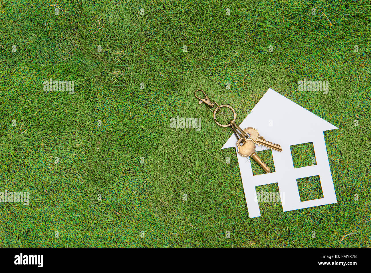 Paper house and key, home environment green living Stock Photo