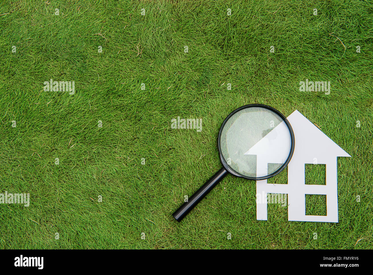 Environmental Conservation Concepts,Green building house Development, Magnifier Scrutiny Stock Photo