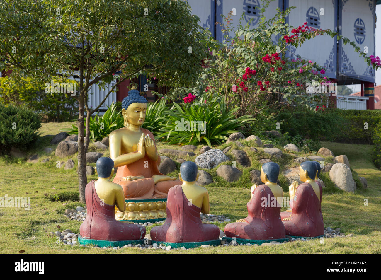 Lumbini, Nepal - November 26, 2014: Photograph of Buddha Statues at the Tara Foundation Lotus Stupa also known as German Temple Stock Photo