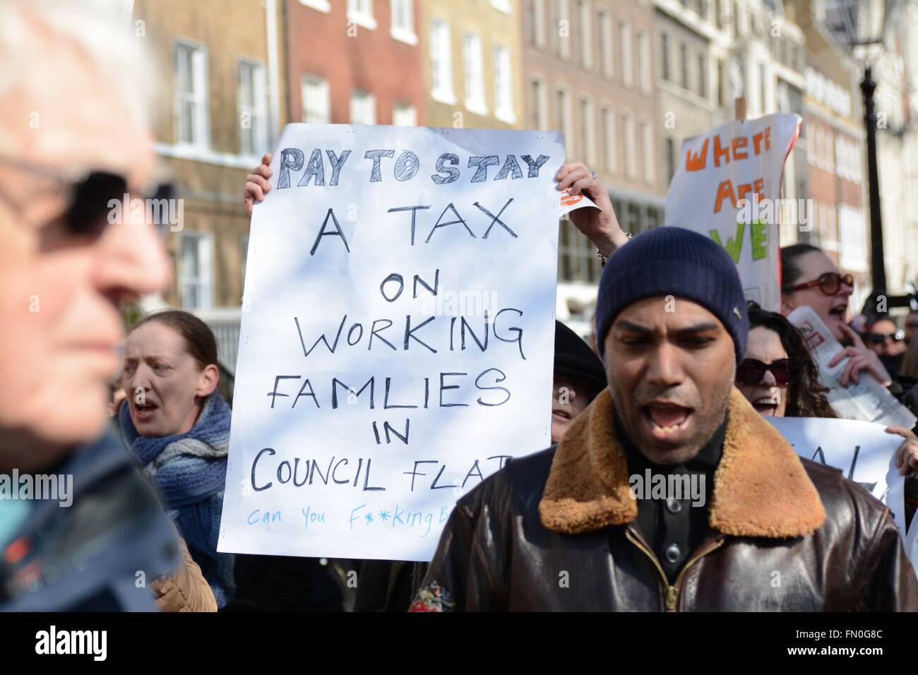 London, UK. 13th March 2016. Protesters hold up a sign protesting the new housing bill. Credit:  Marc Ward/Alamy Live News Stock Photo