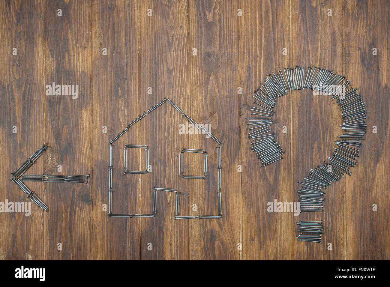 move house question, house price rises, housing market hike, Group of nail Stock Photo