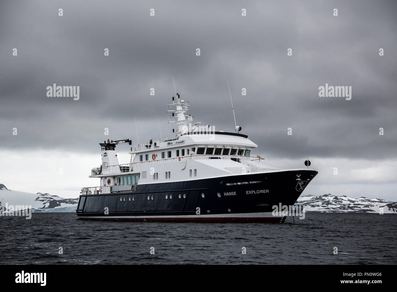 Antarctica, South Shetland Islands, King George Island,  expedition ship Hanse Explorer at anchor. Stock Photo