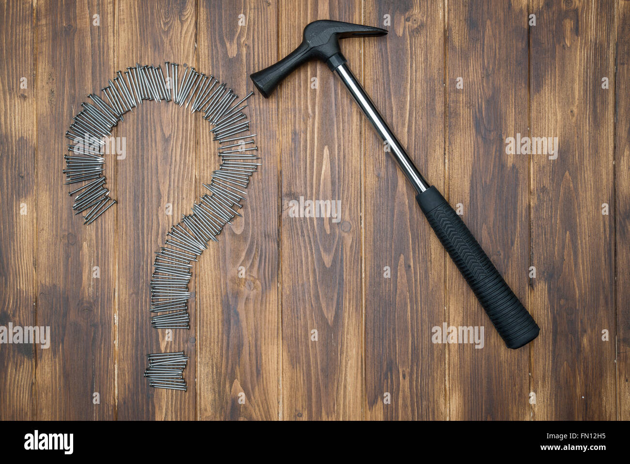 Solving DIY problem, Group of nail on Question Mark with hammer Stock