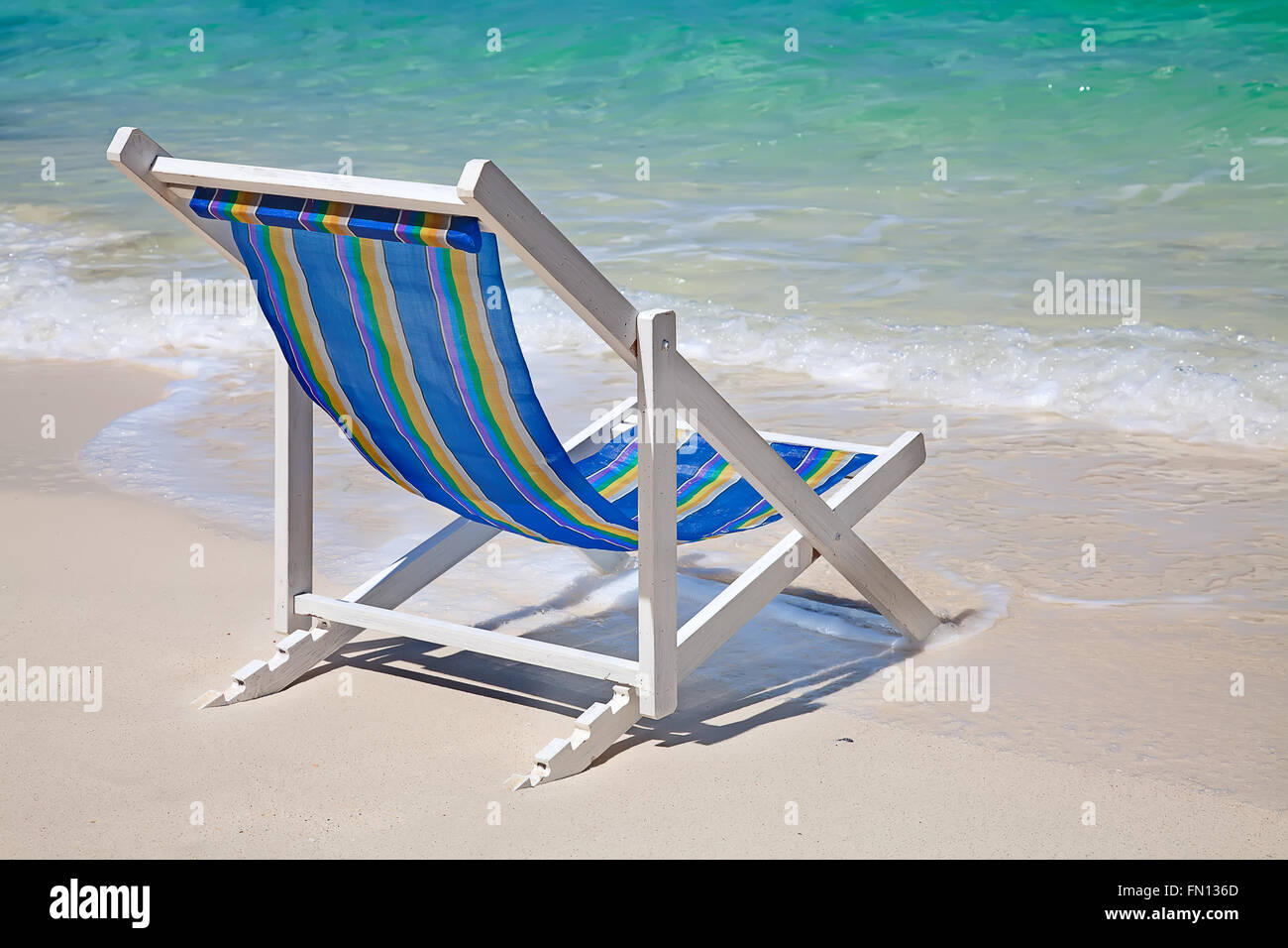 Colorful chairs on the white sandy beach Stock Photo