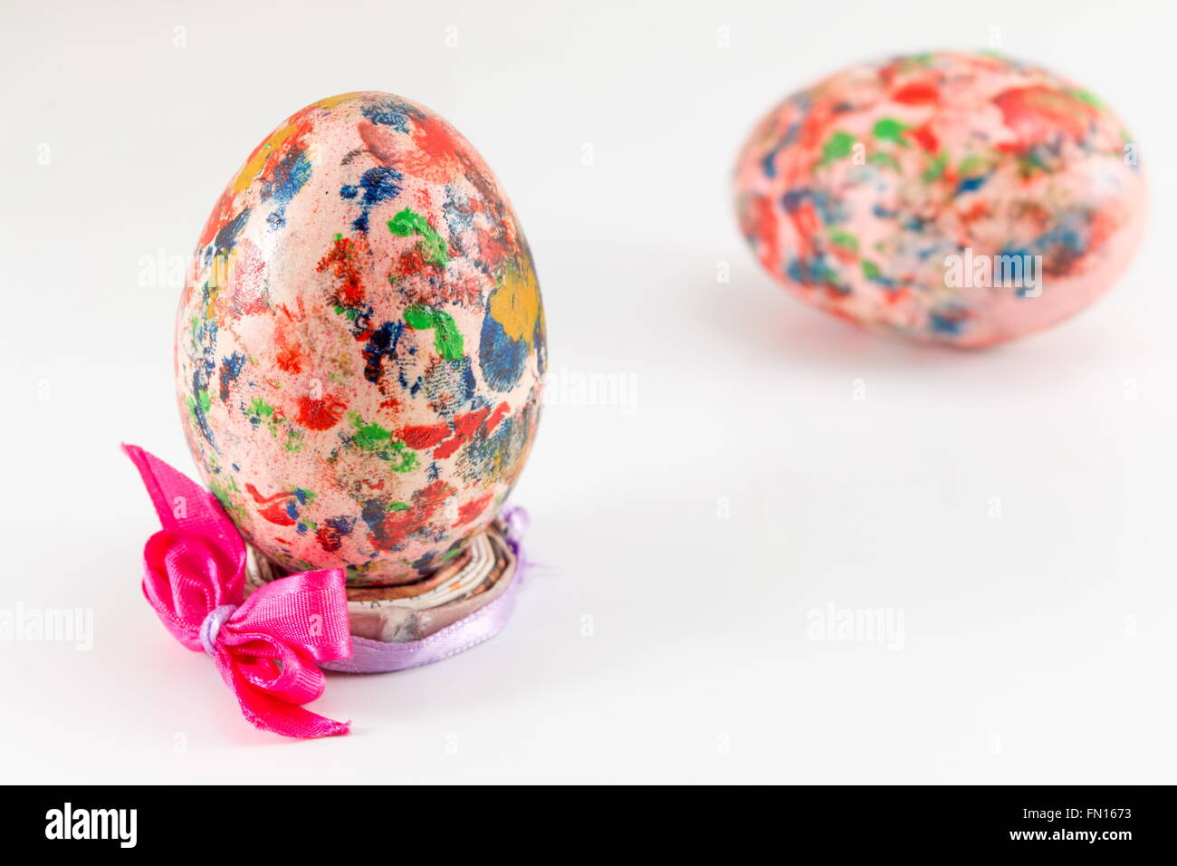 Painted Easter egg in custom made egg holder Stock Photo