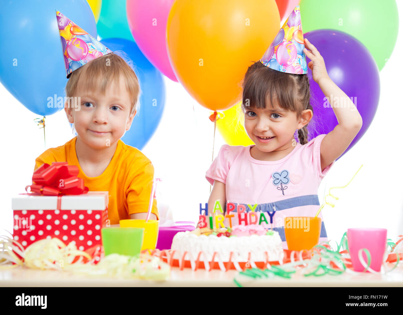 Kids - girl and boy having fun at birthday party Stock Photo