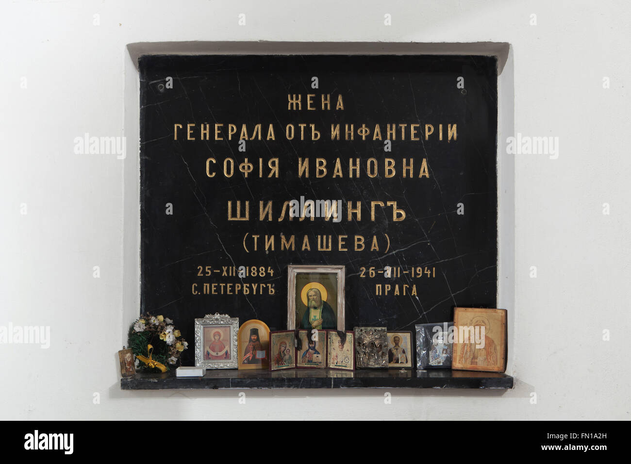 Grave of Sofia Schilling, a wife of Russian general Nikolai Schilling, in the underground crypt of the Dormition Church at the Olsany Cemetery in Prague, Czech Republic. Sofia Ivanovna Schilling, nee Timasheva, born in St Petersburg on December 25, 1884, was a wife of Lieutenant general Nikolai Schilling (1870 - 1946), who served as military officer in the Imperial Russian Army during World War I and in the White Army during the Russian Civil War. She lived in exile in Czechoslovakia afterward with her husband and died at age 56 on July 26, 1941. Her burial place is decorated with an orthodox Stock Photo